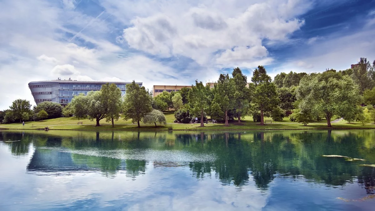 Duke of Kent Building beside the lake on the University of Surrey’s Stag Hill campus